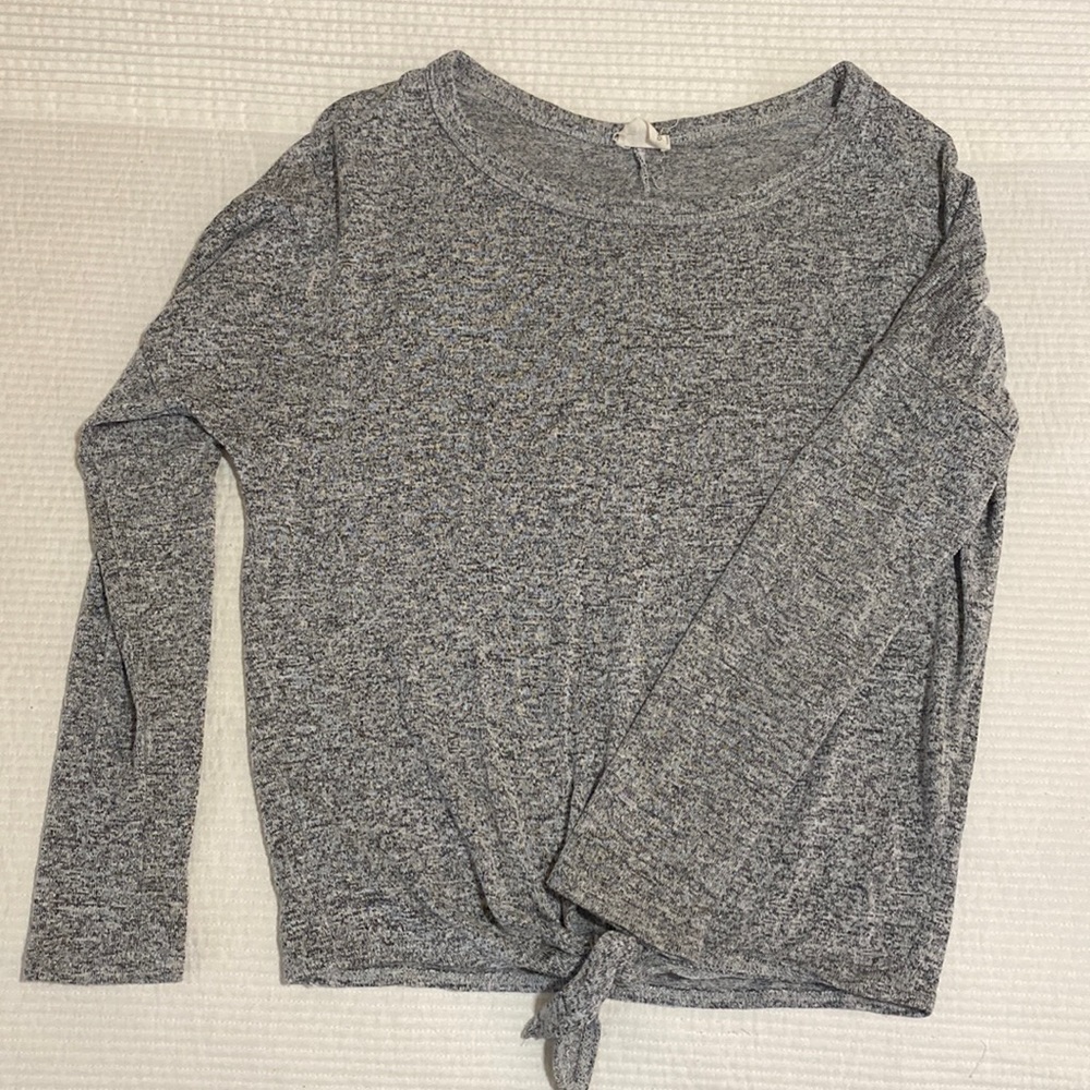 Tied long sleeved shirt.